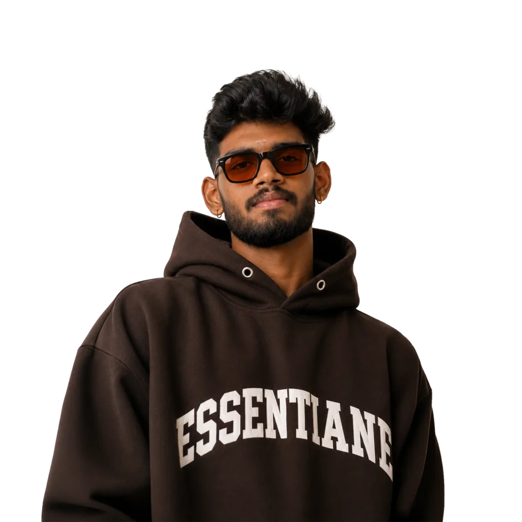 Harikrishna M K, the best digital marketer in Palakkad, wearing a brown Essentials hoodie and sunglasses with a confident pose, representing expertise in SEO, website design, branding, graphic design, and digital marketing.